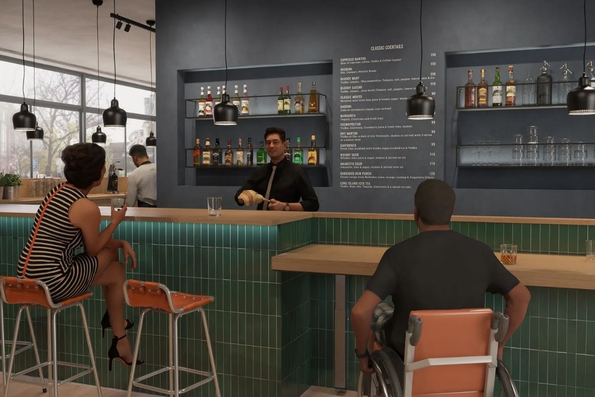 Woman sits at a bar counter near a wheelchair user seated at a customized lower counter