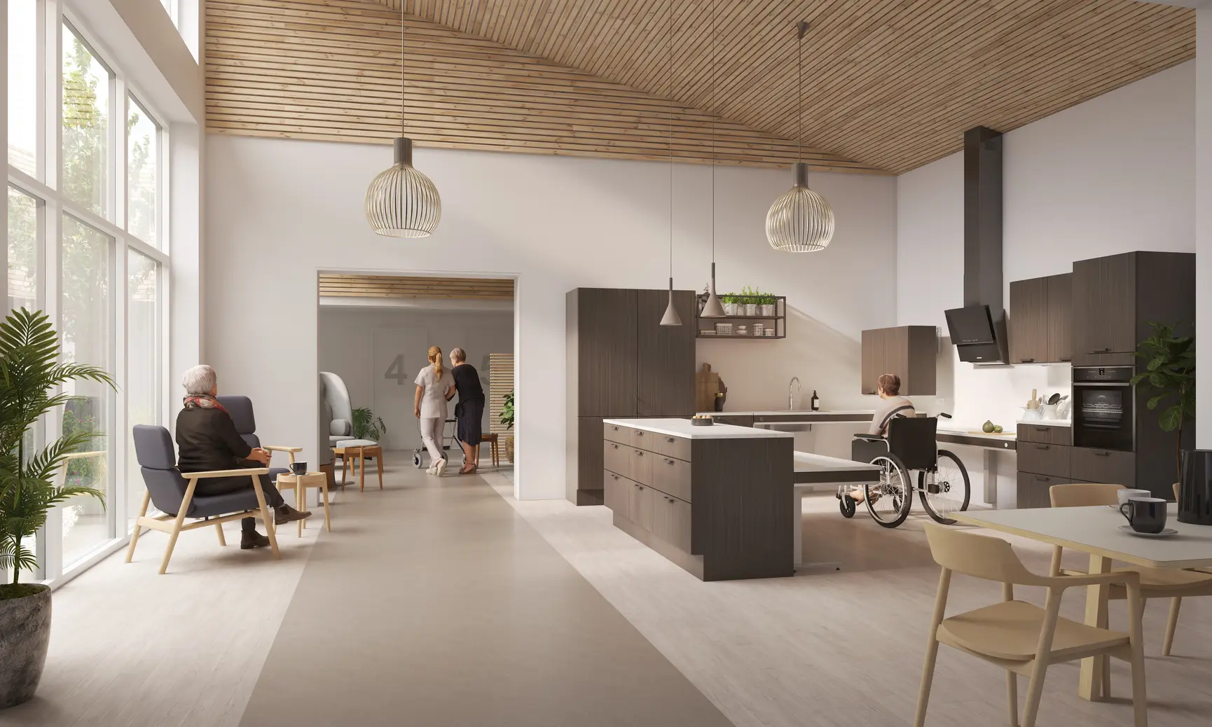 A care home facility resident sits at a customized height-adjustable kitchen tabletop. Source - Pressalit 
